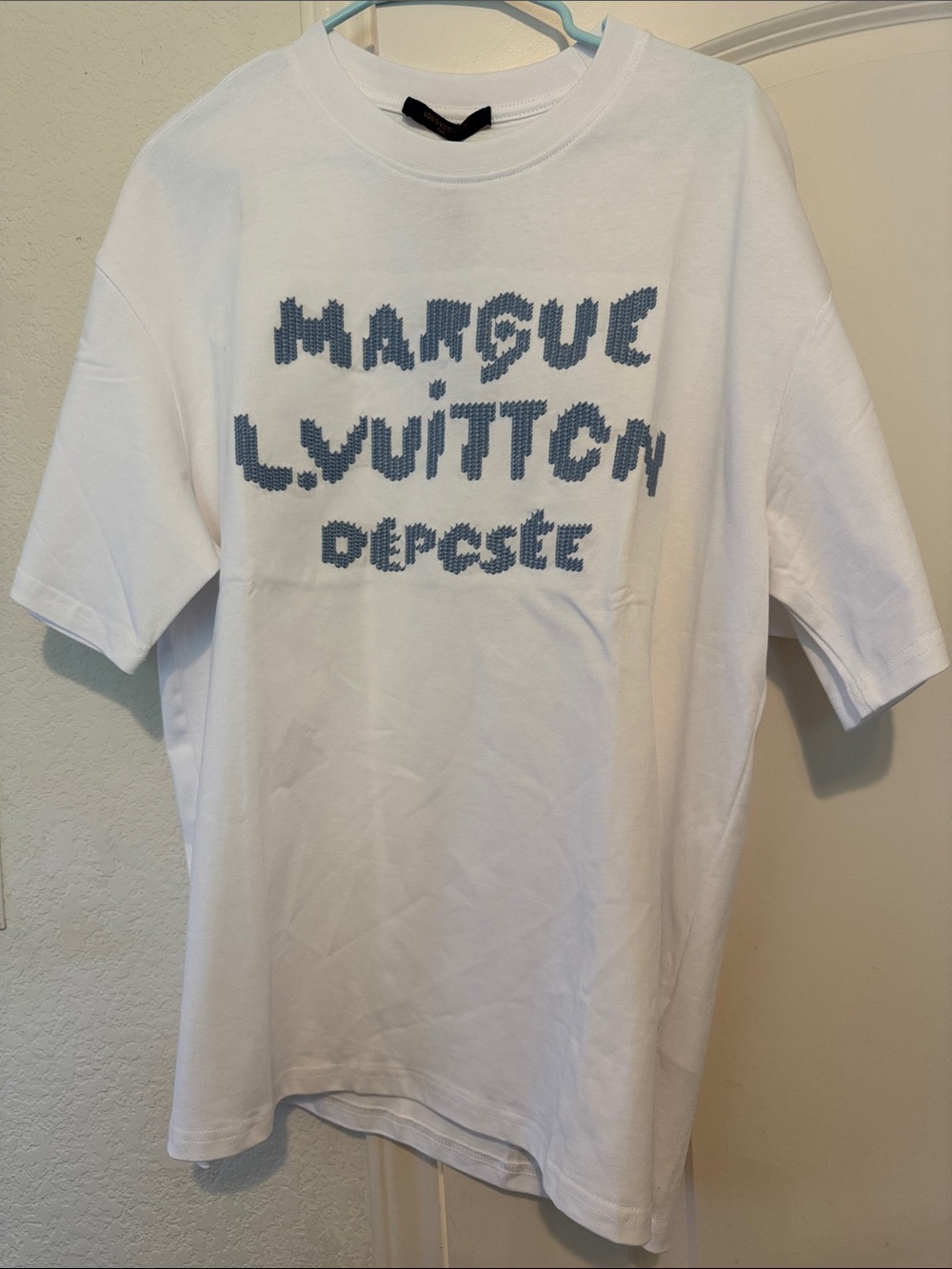 White Graphic T-Shirt with Blue Knit-Style Text